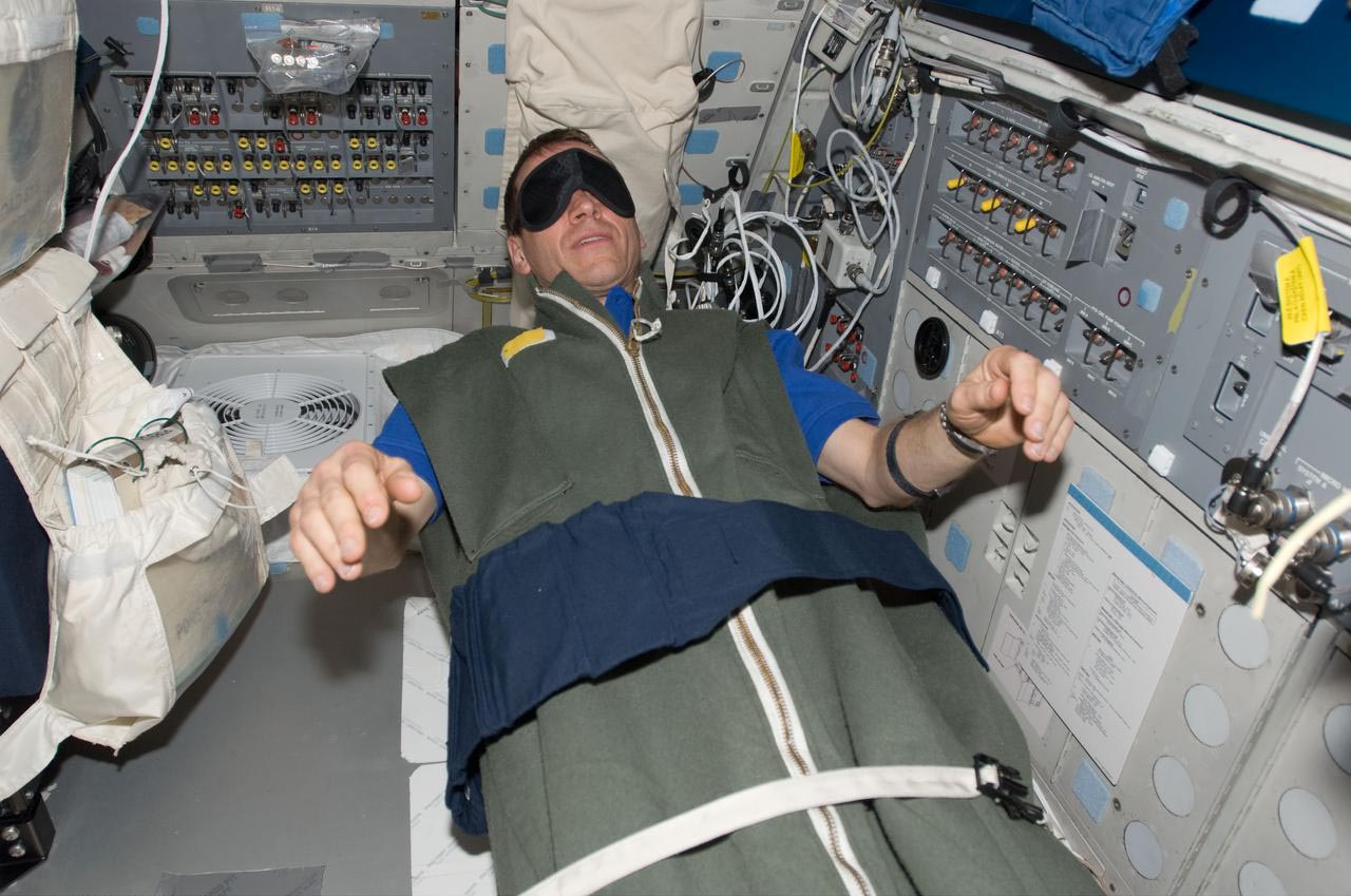 Astronaut Sleeping In Space