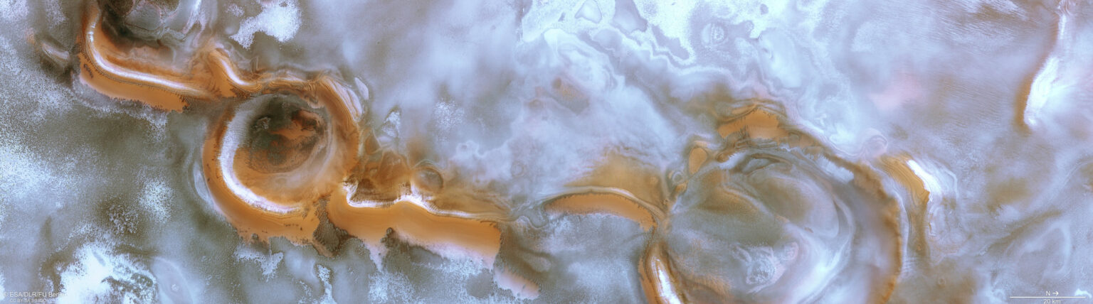 https://universemagazine.com/wp-content/uploads/2022/12/swirling_craterscape_at_the_south_pole_of_mars_pillars.jpg