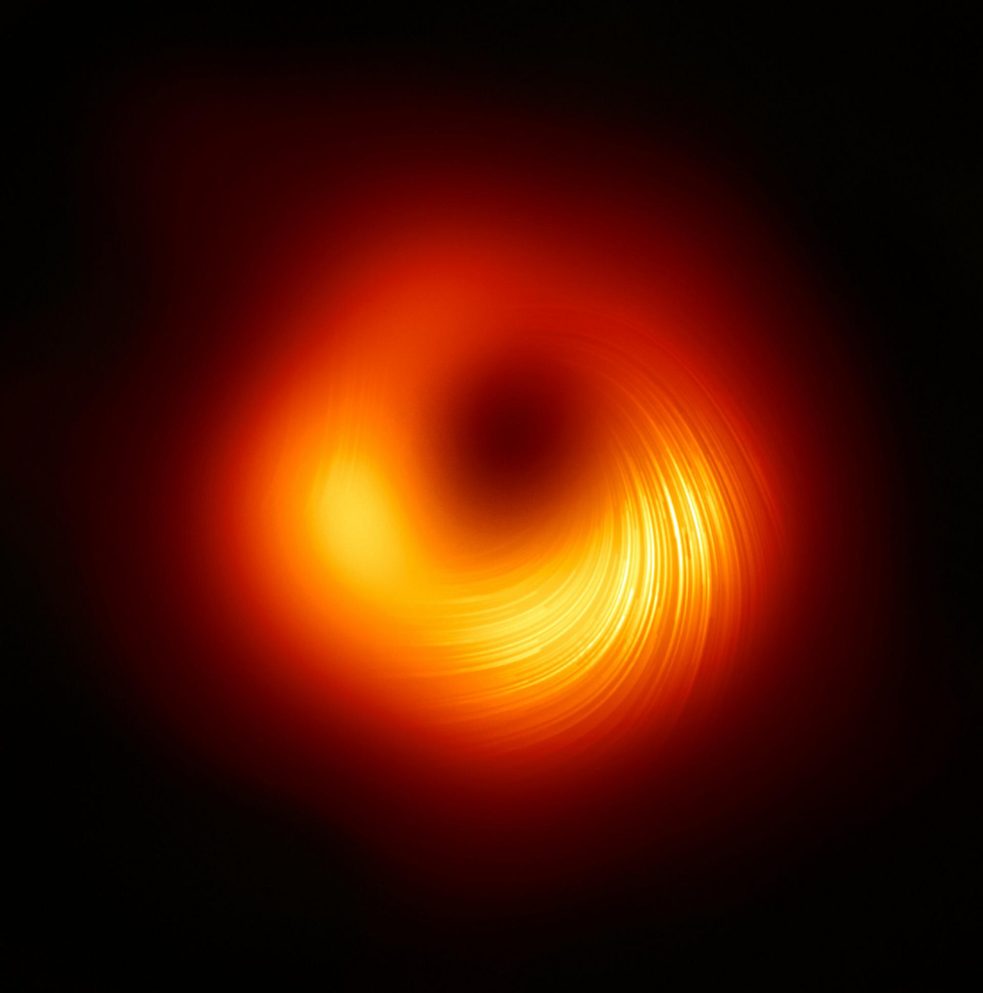 Зображення чорної дірки у центрі галактики M87 у поляризованому світлі. Джерело: EHT Collaboration