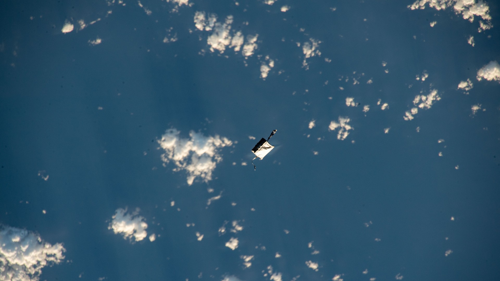 Space debris distorts a photo of astronaut on the ISS