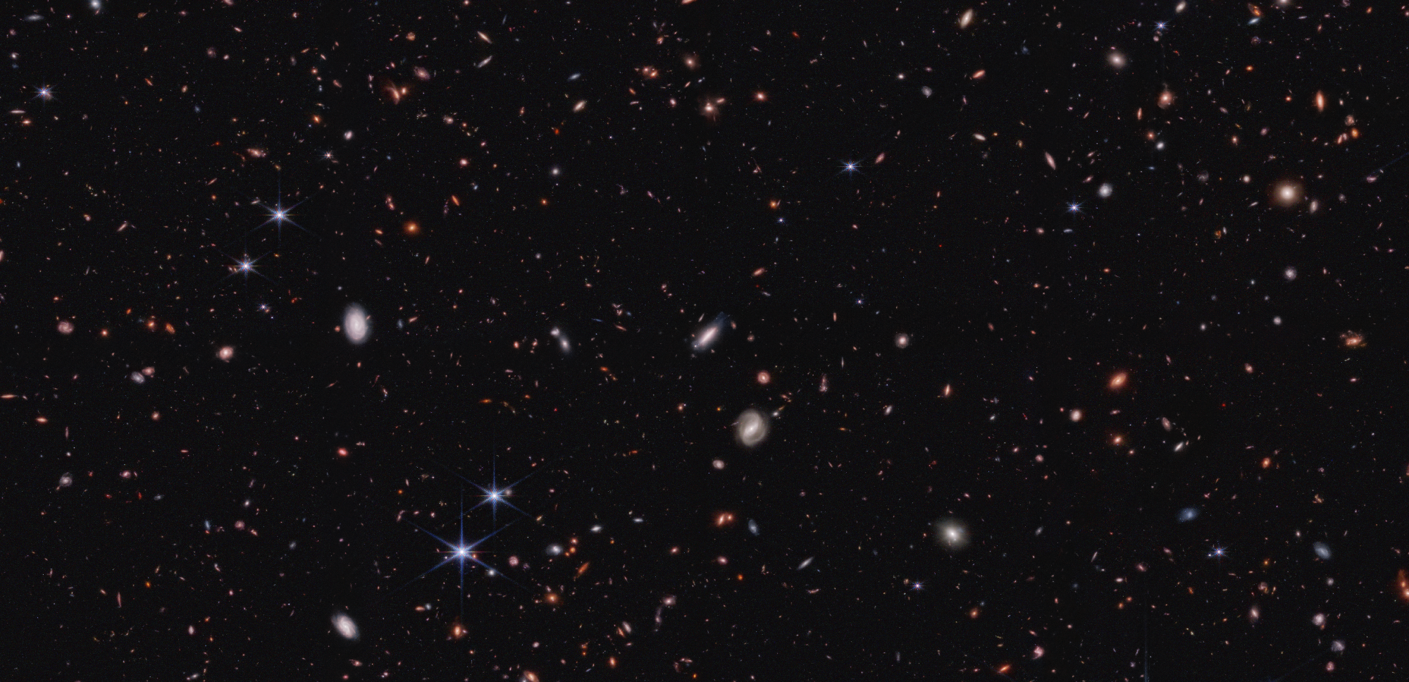 Overly massive galaxies and black holes: Astronomers overcome the cosmological crisis